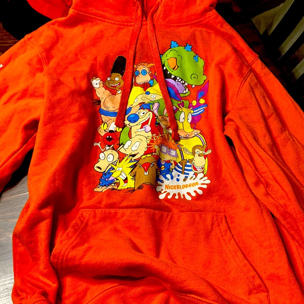 Orange hoodie, super colorful and comfortable and many Nickelodeon characters.